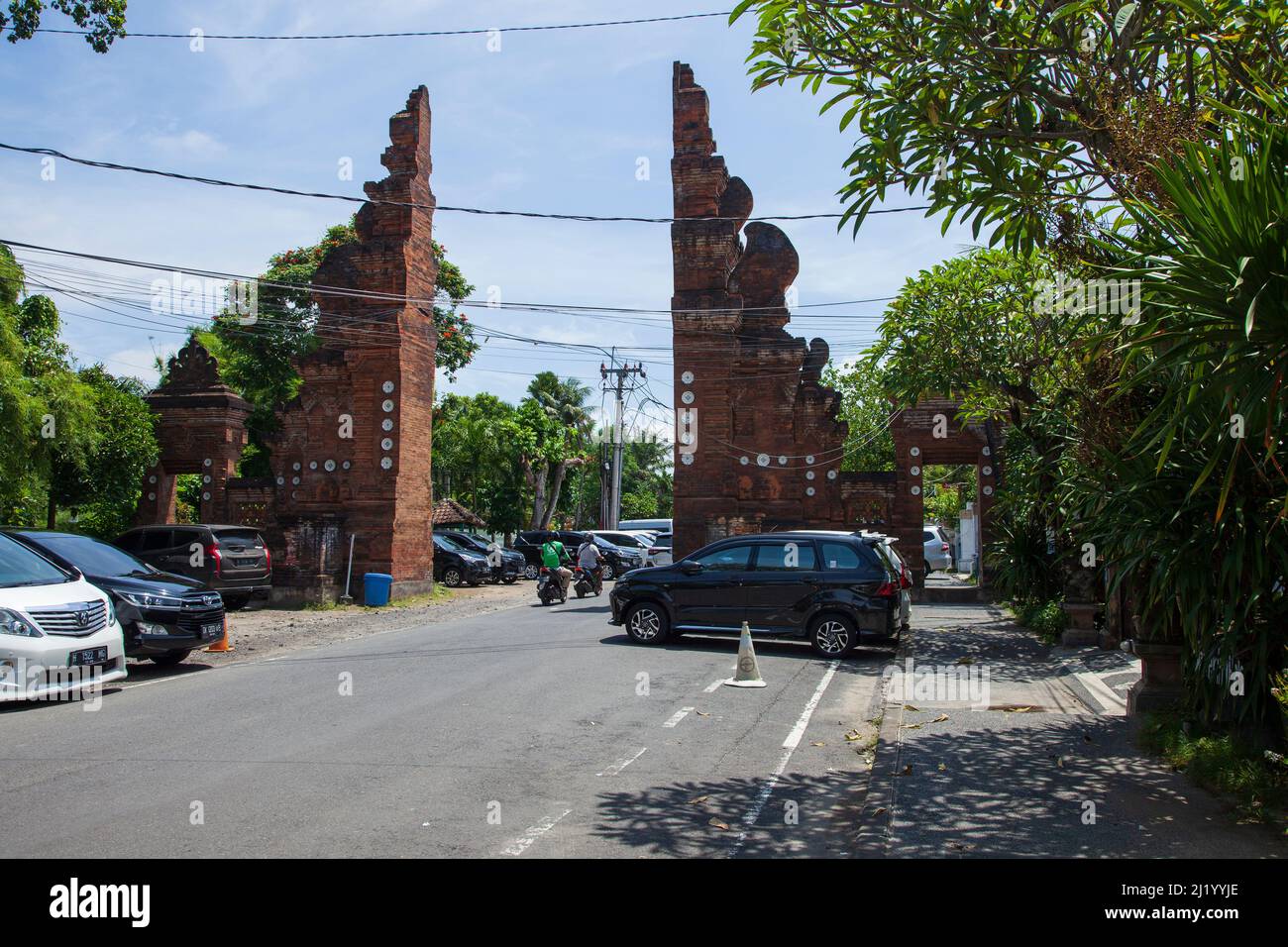 Traditional Balinese style gate at the entrance to the beach road on Jalan Hang Tuah North Sanur in Bali, Indonesia Stock Photo