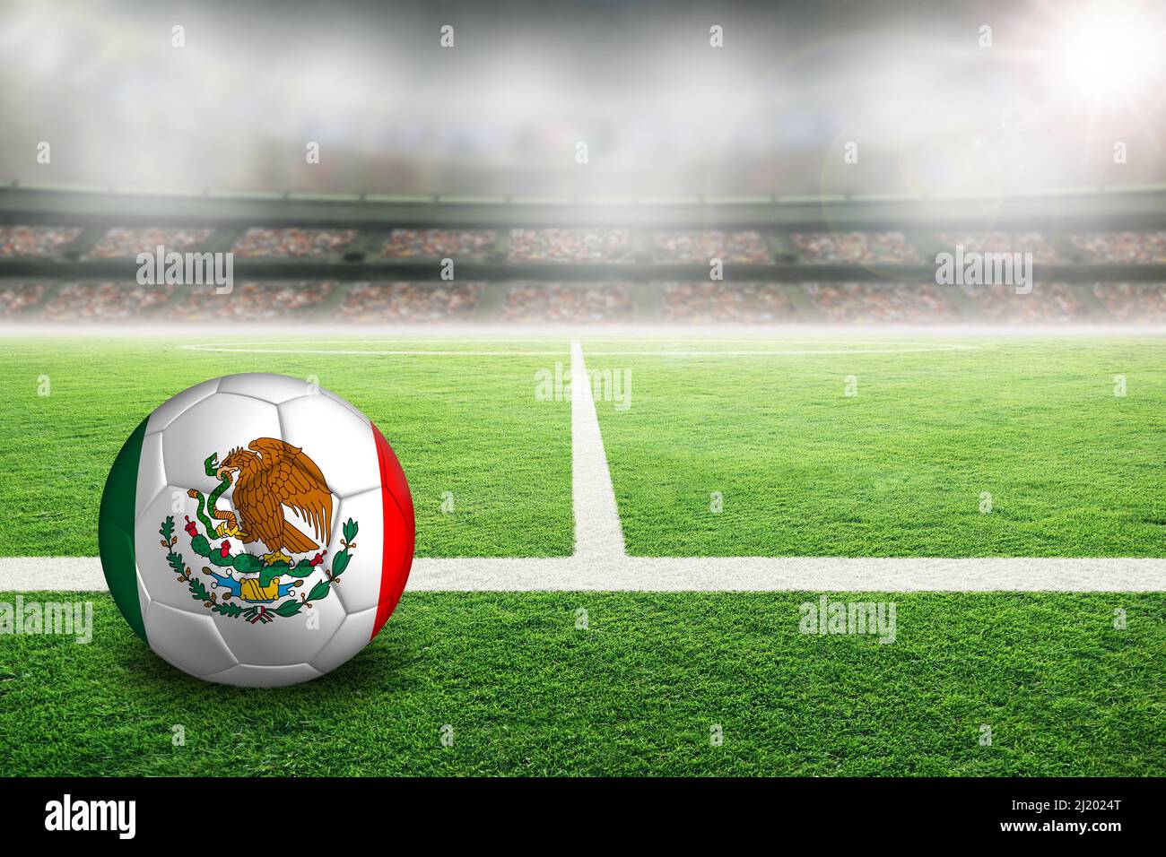 Football in brightly lit outdoor stadium with painted flag of Mexico. Focus on foreground and soccer ball with shallow depth of field on background an Stock Photo