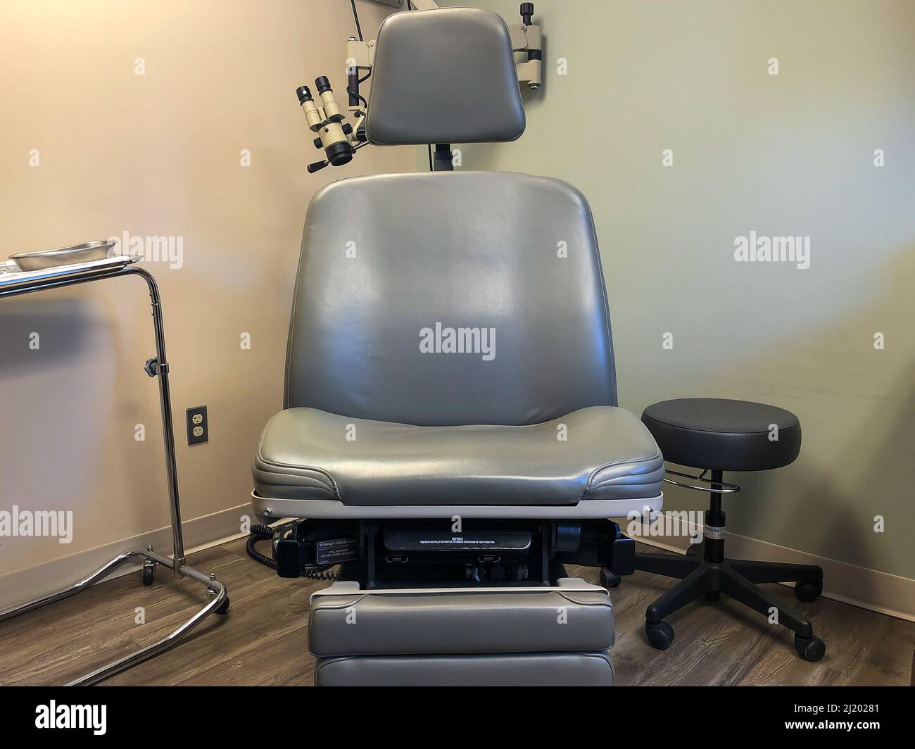 Closeup of a gray Medical Examination and Treatment Chair in the corner
