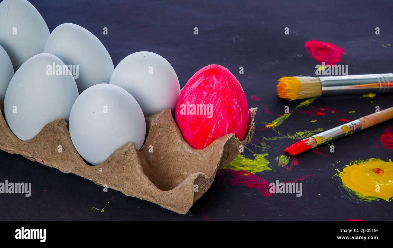 Easter eggs painting set up on black background with sopy space Stock