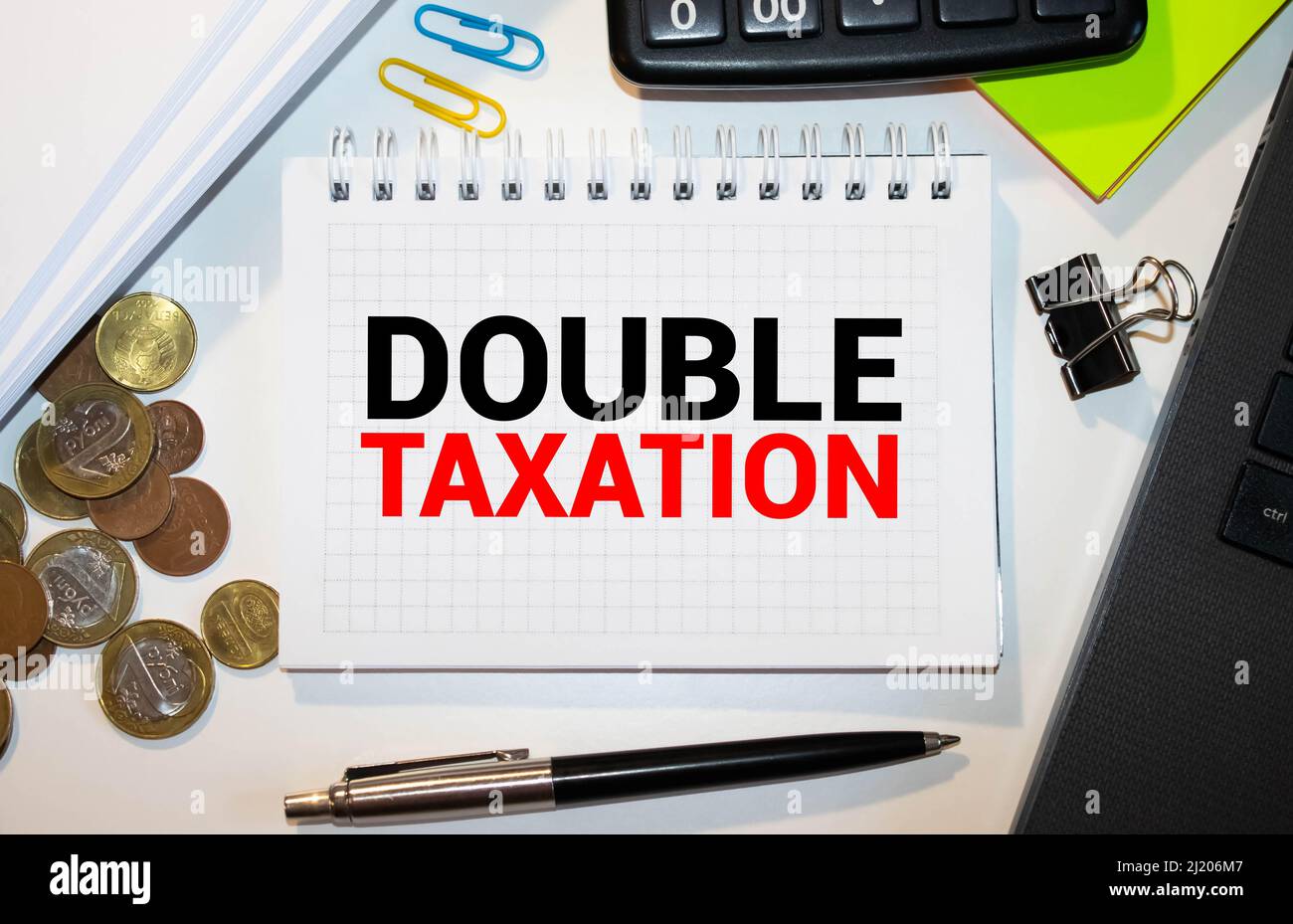 Notepad with text DOUBLE TAXATION. White background Stock Photo - Alamy