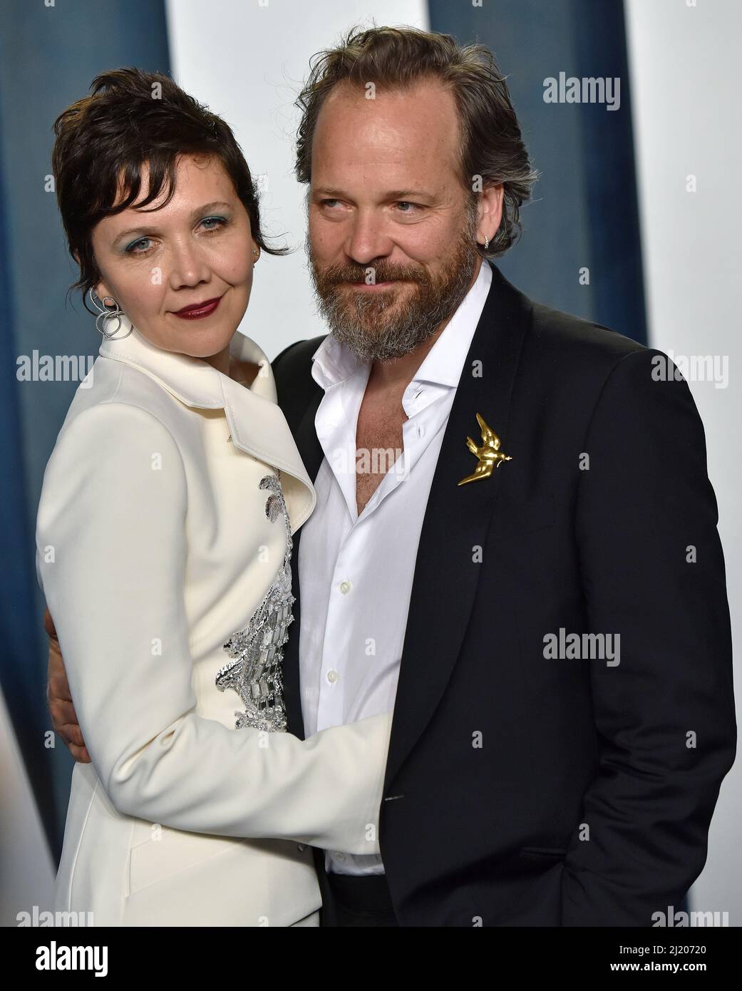 Beverly Hills, United States. 28th Mar, 2022. Maggie Gyllenhaal (L) and Peter Sarsgaard arrive for the Vanity Fair Oscar Party at the Wallis Annenberg Center for the Performing Arts in Beverly Hills, California on Sunday, March 27, 2022. Photo by Chris Chew/UPI Credit: UPI/Alamy Live News Stock Photo