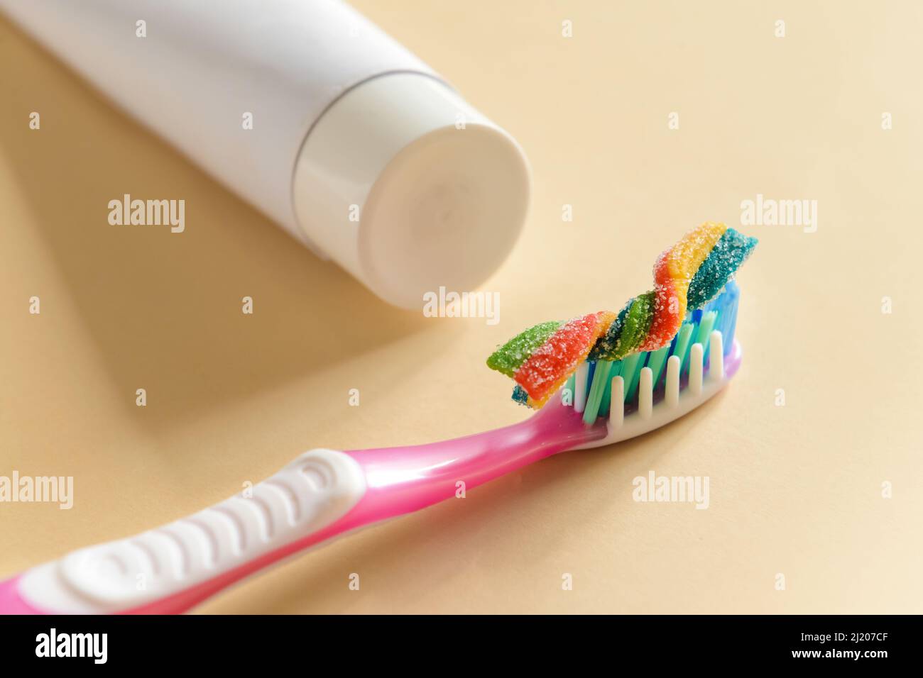 Chewing gum with tooth brush and paste on light background Stock Photo