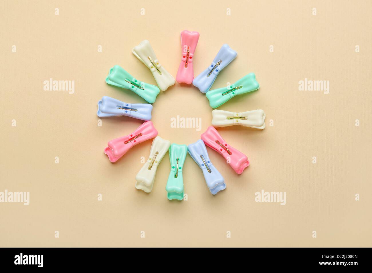 Plastic clothes pins on light background Stock Photo