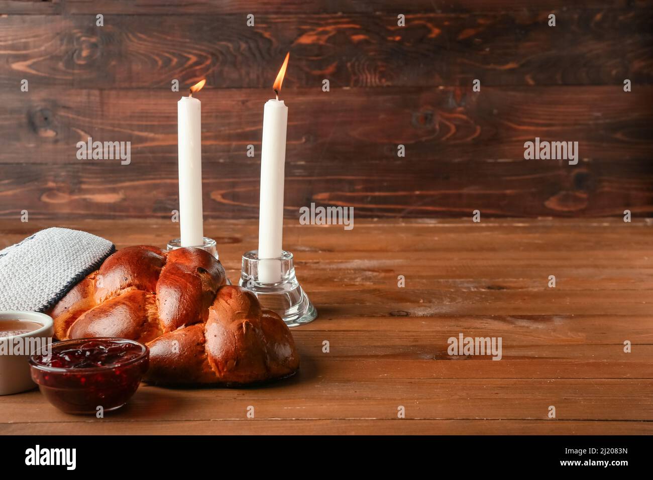 Hot plate for the Sabbath. Pot with traditional food and challah-special  bread in Jewish cuisine. Traditional food Jewish Shabbat Stock Photo - Alamy