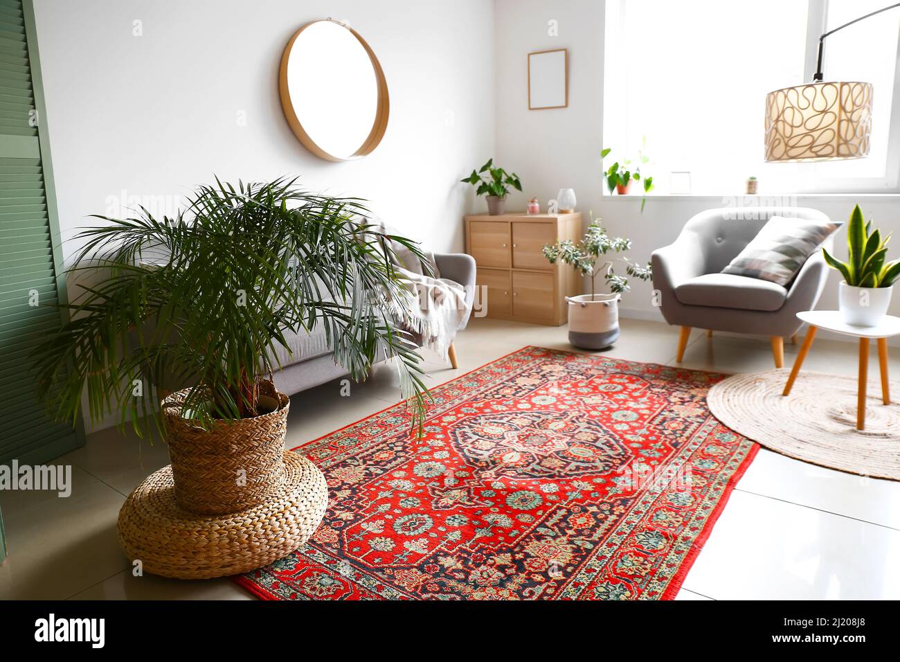Interior of cozy living room with armchair, houseplants and vintage ...