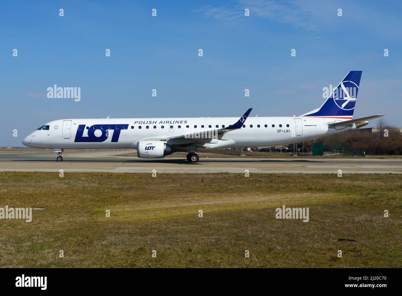 LOT Polish Airlines Embraer 195 aircraft taxiing before departure to Warsaw, Poland. Airplane E195 of LOT Polish (Polskie Linie Lotnicze). Stock Photo