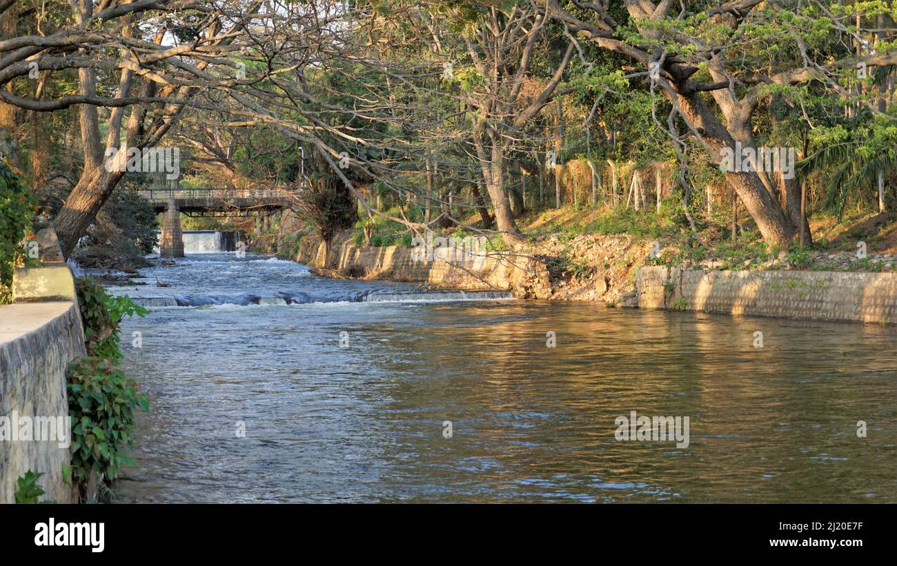 View of Cauvery river from bridge in Brindavan Gardens located inside KRS or Krishna Raja Sagara Dam. Beautiful relaxation place for people from all a Stock Photo