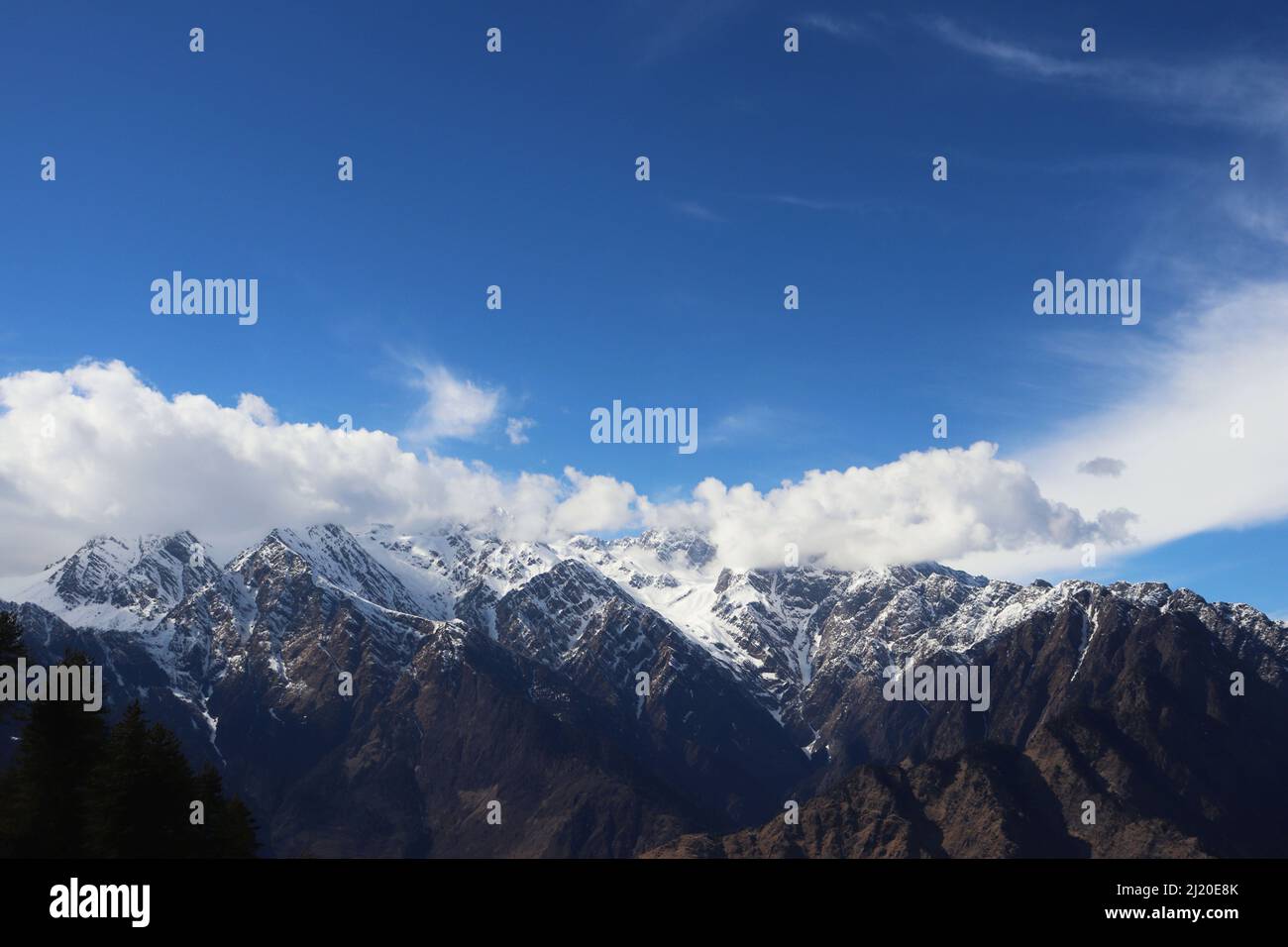 snow mountain with blue sky and clouds background Stock Photo - Alamy