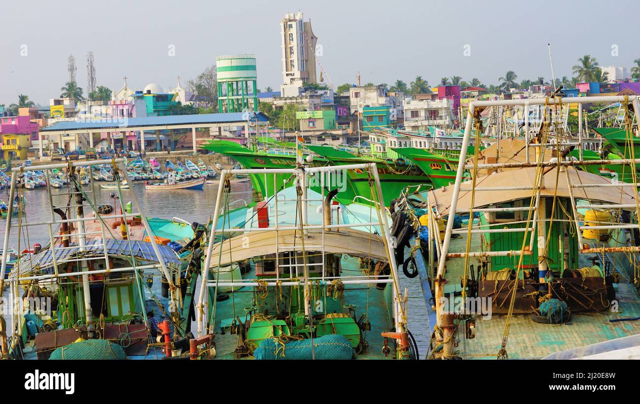 Colachel,Tamilnadu,India-December 23 2021: Boats and ships docked in Colachel Fishing harbor. Amazing view of silent harbour on christmas eve Stock Photo