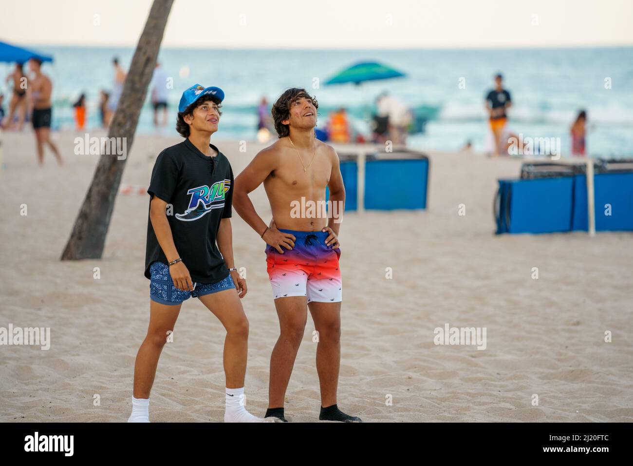 Fort Lauderdale, FL, USA March 27, 2022 Male friends looking upward