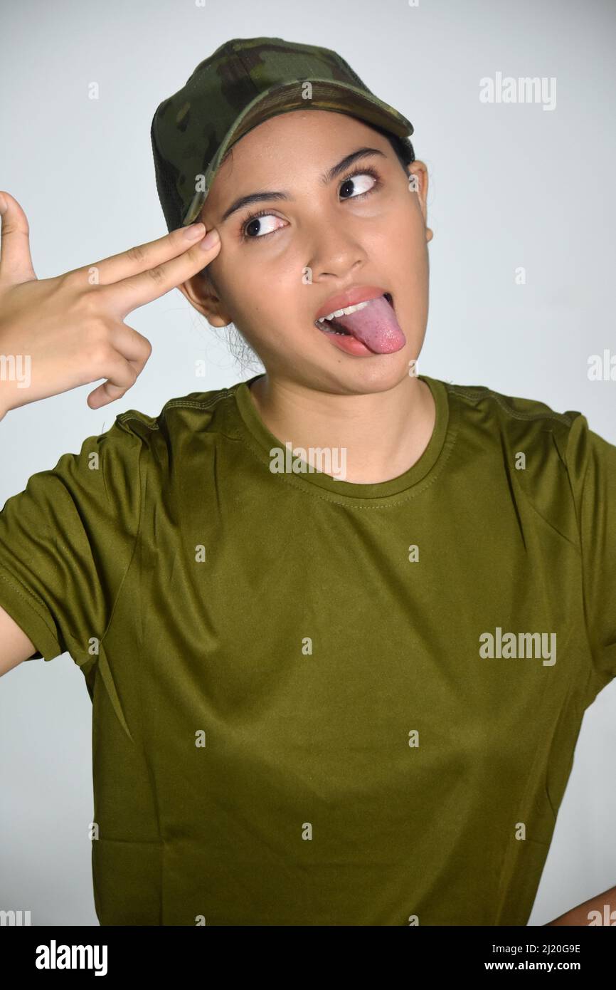 Female Soldier With Gun Hand Gesture Funny Face Stock Photo