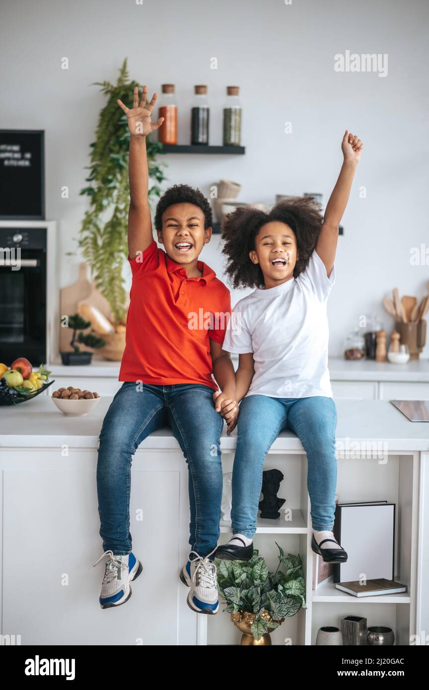 Joyful sibling hi-res stock photography and images - Alamy