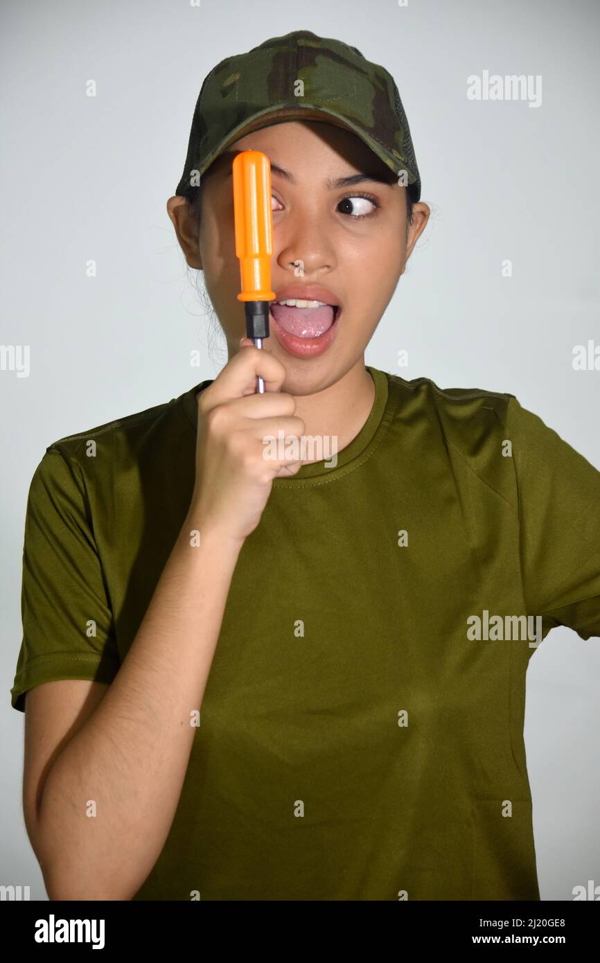 A Funny Female Soldier With Screwdriver Stock Photo Alamy