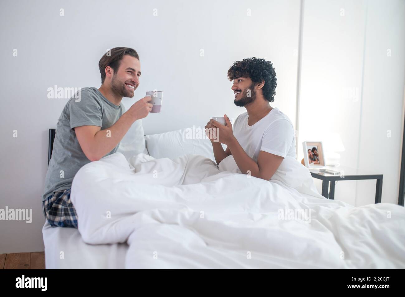 Gay couple drinking coffee in the morning Stock Photo