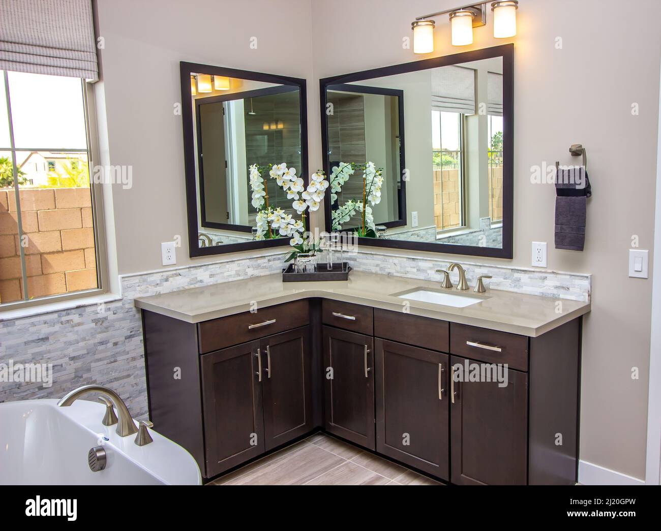 Master Bathroom With Mirrors And Corner Vanity Stock Photo Alamy