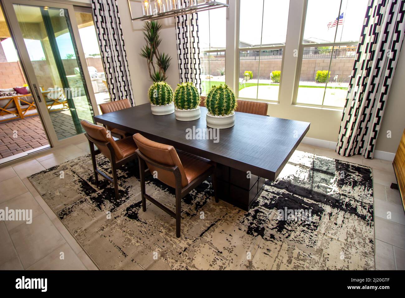 Dining Area With Oblong Wooden Table And Upholstered Chairs Stock Photo ...