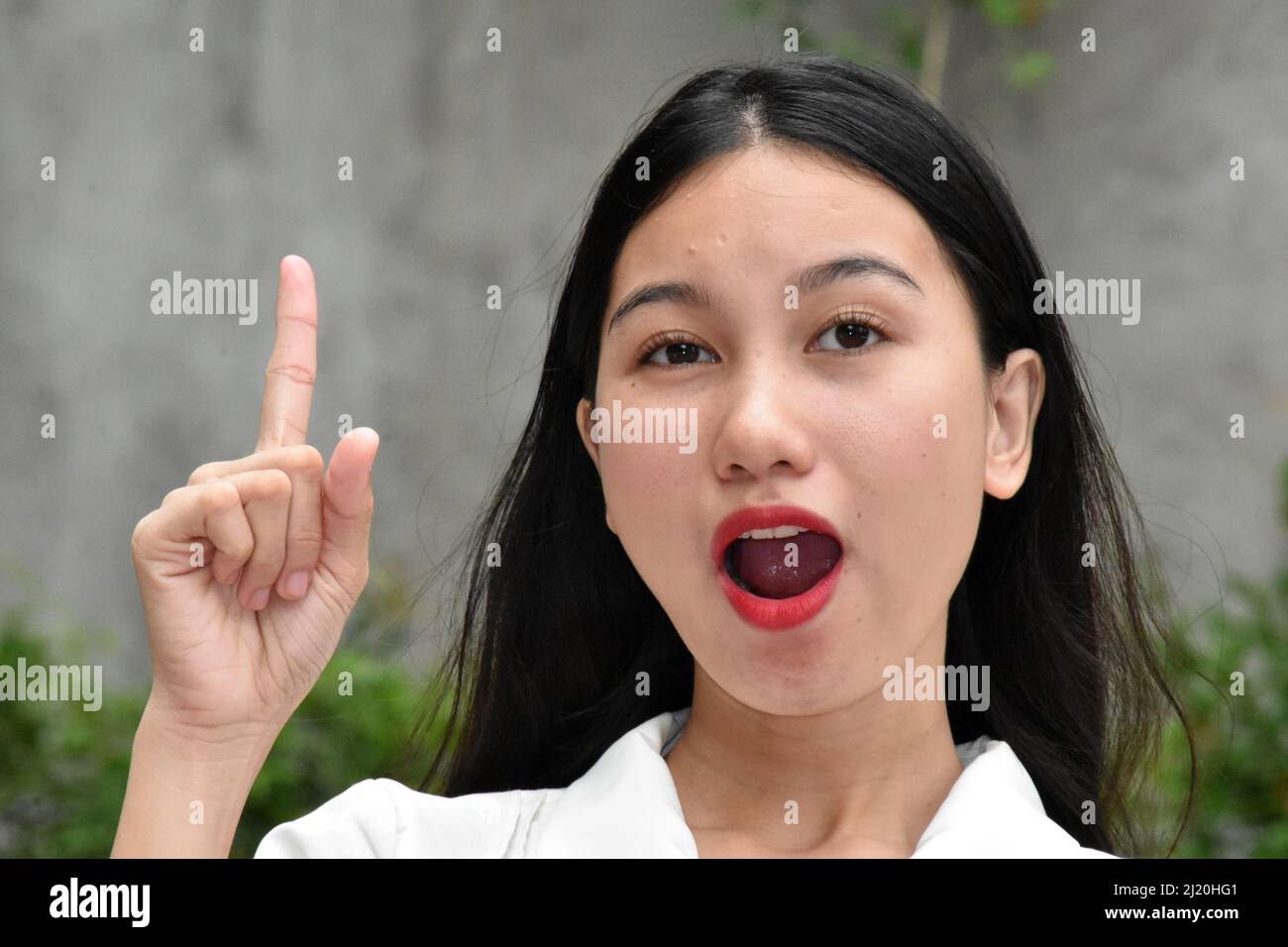 Smart Asian Woman Having An Idea Stock Photo