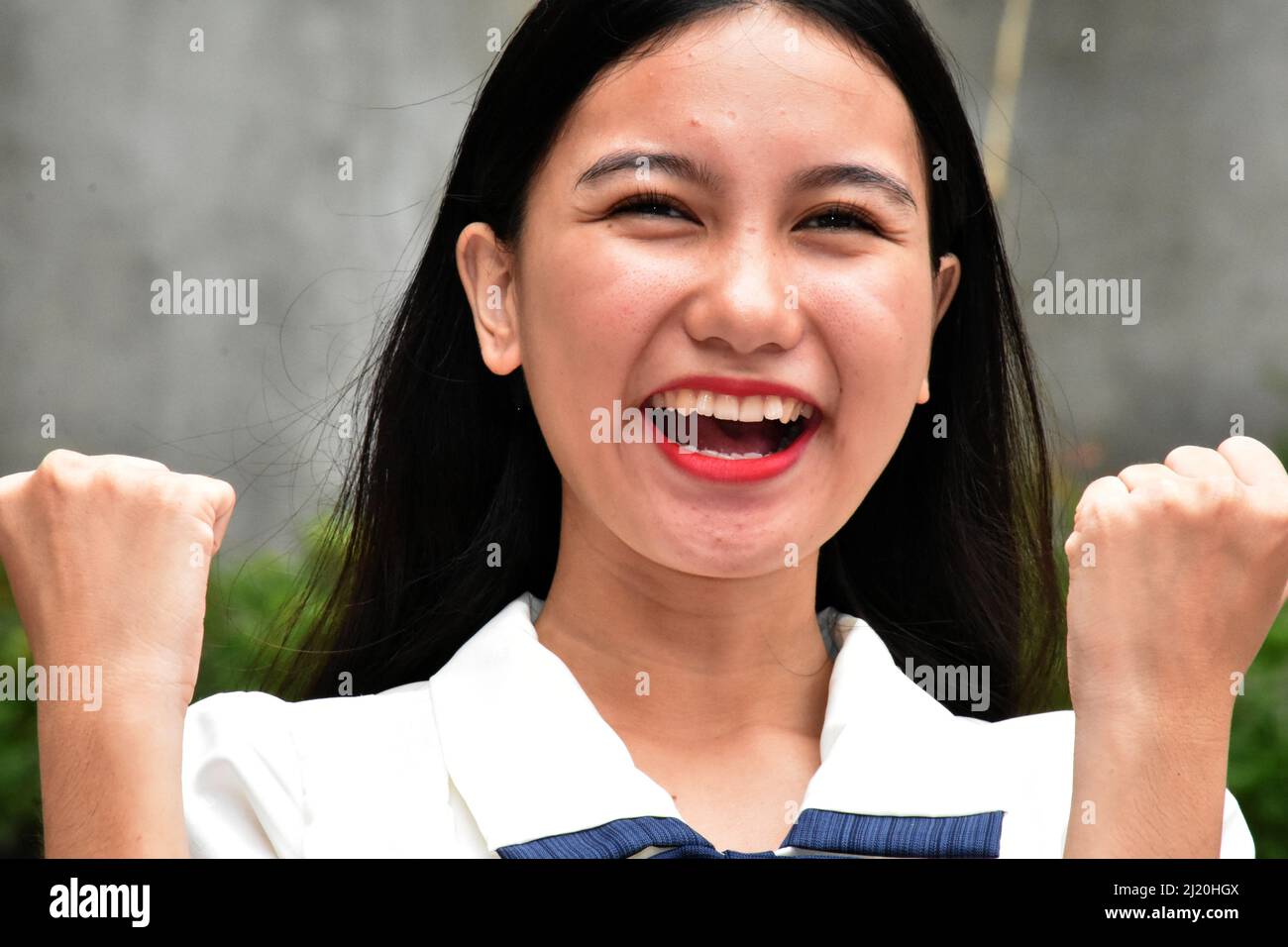A Proud Excited Asian Woman Stock Photo - Alamy