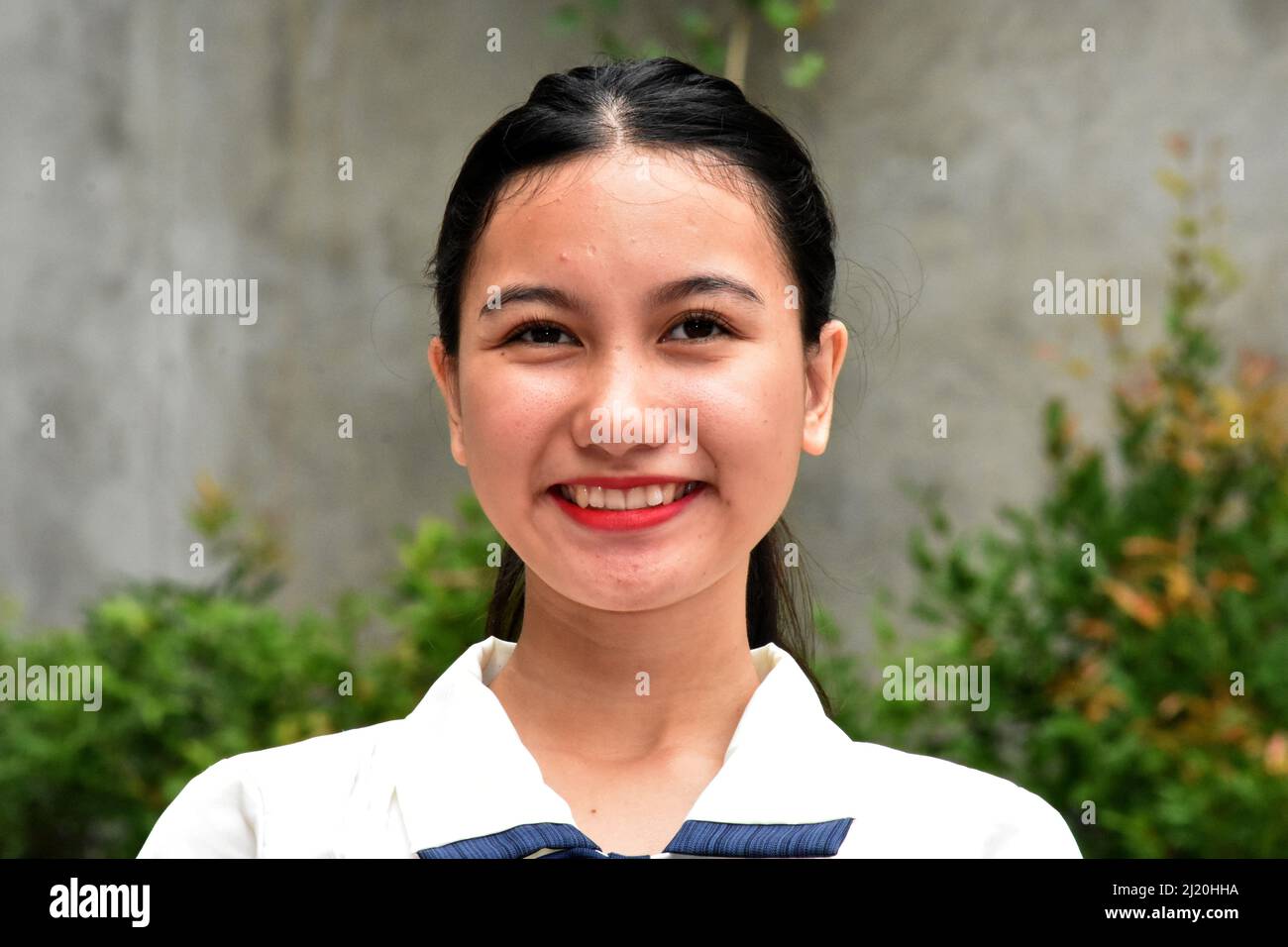 A Smiling Asian Woman Headshot Stock Photo