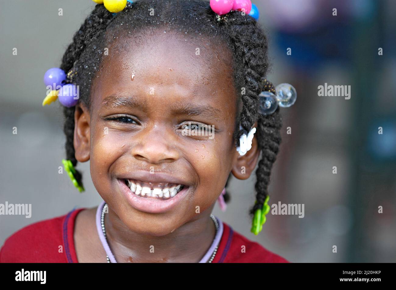 ethnic black afro Little girls, girl, sisters, face with beads in hair, 3 and 5 Stock Photo Alamy