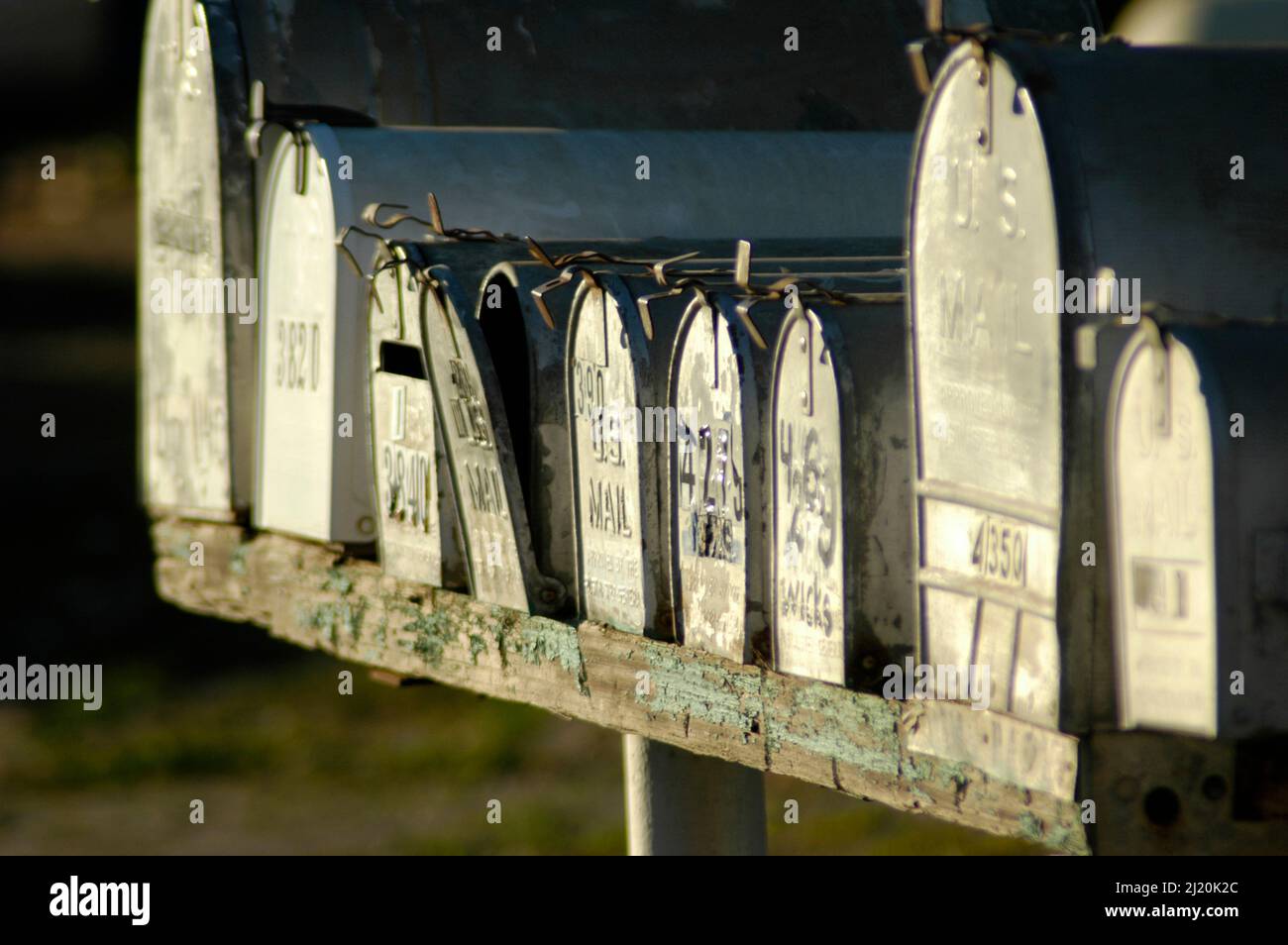 Row of Mail boxes on rural route in farm land of central California