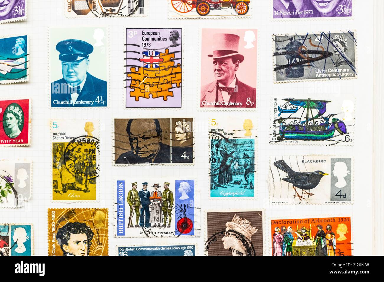 vintage British stamps in a stamp album collection featuring Winston Churchill and the European economic community  or EEC Stock Photo