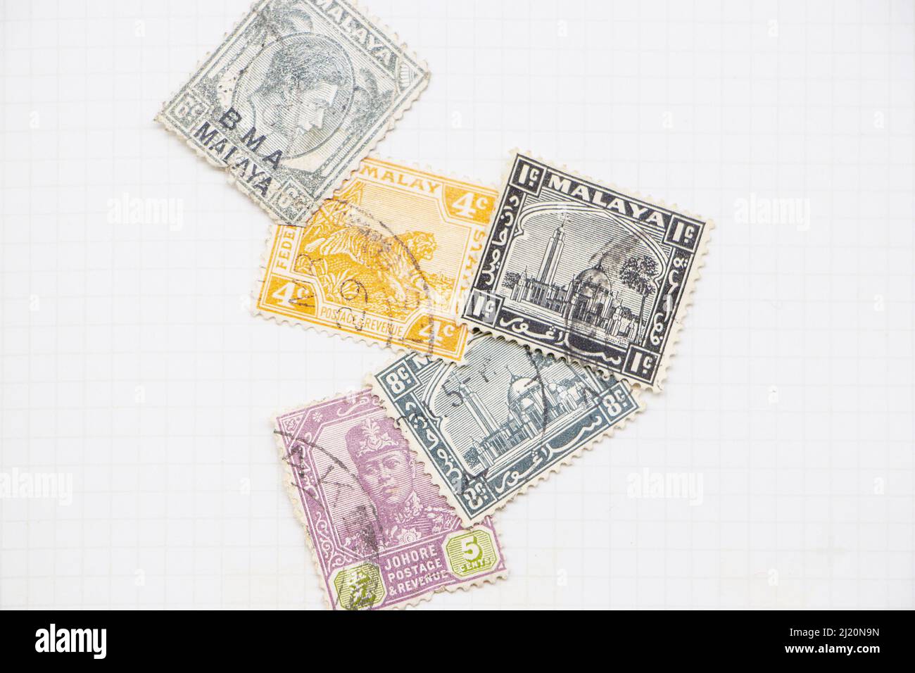 vintage stamps from Malaya now Malaysia  in a stamp album collection Stock Photo