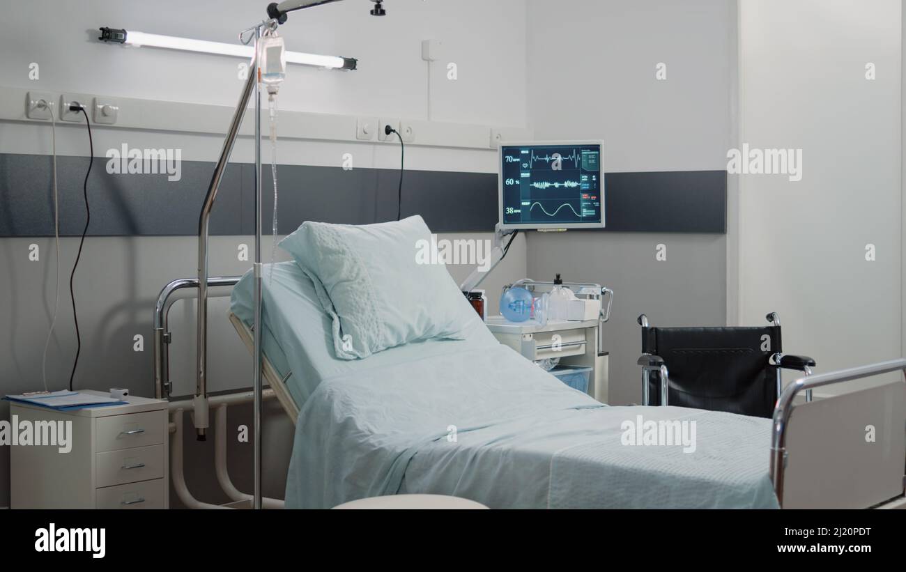 Hospital Ward With Bed And Heart Rate Monitor At Facility Empty Room Hospital Ward With Bed And Heart Rate Monitor At Facility Empty Room