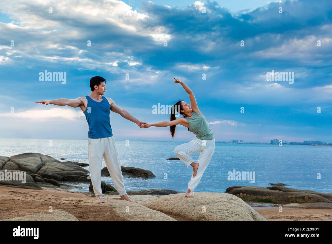 Yoga instructor standing one leg hi-res stock photography and