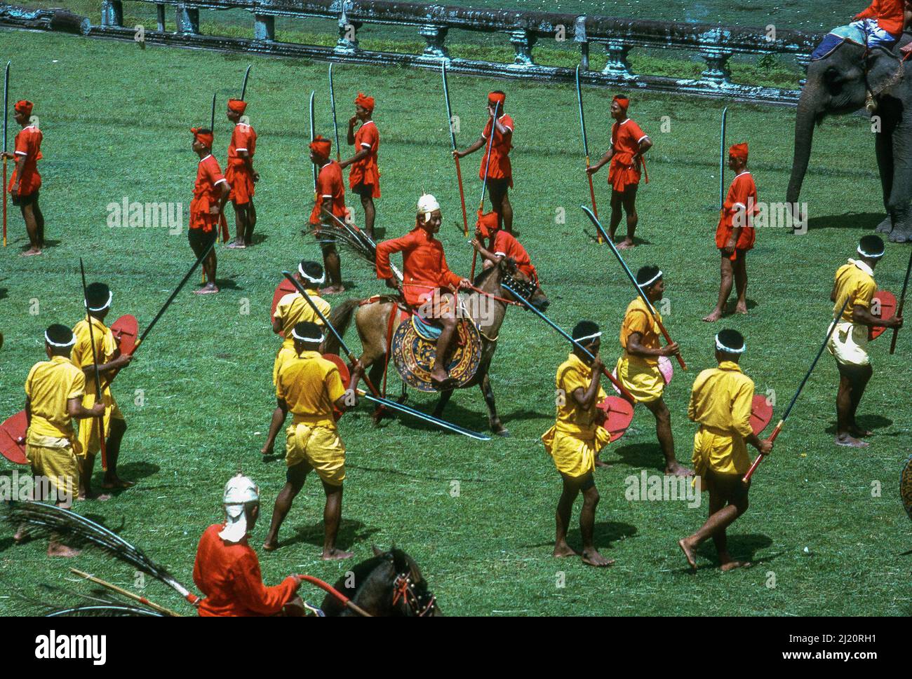 Costumed actors re-enact historic battles for a movie being directed by Prince Norodom Sihanouk, at Angkor Wat, Cambodia, 1966 Stock Photo
