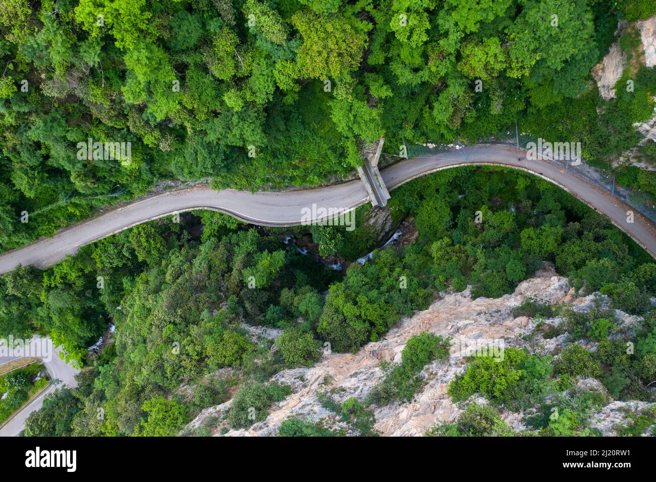 A bridge crosses the road  Strada della Forra, Tremosine, Lake Garda, Lombardy, Italy, Europe Stock Photo