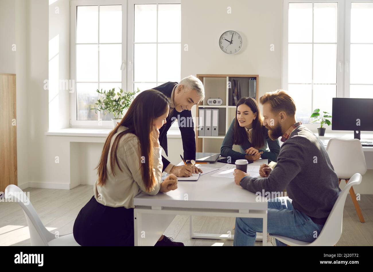 Diverse colleagues brainstorm over business project together Stock ...