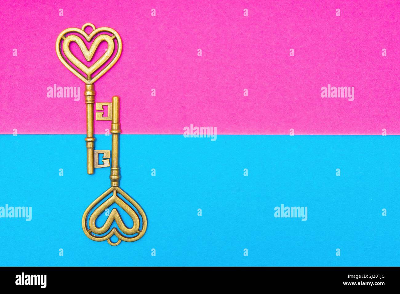 Two antique style heart shaped skeleton keys on a vivid contrast ...