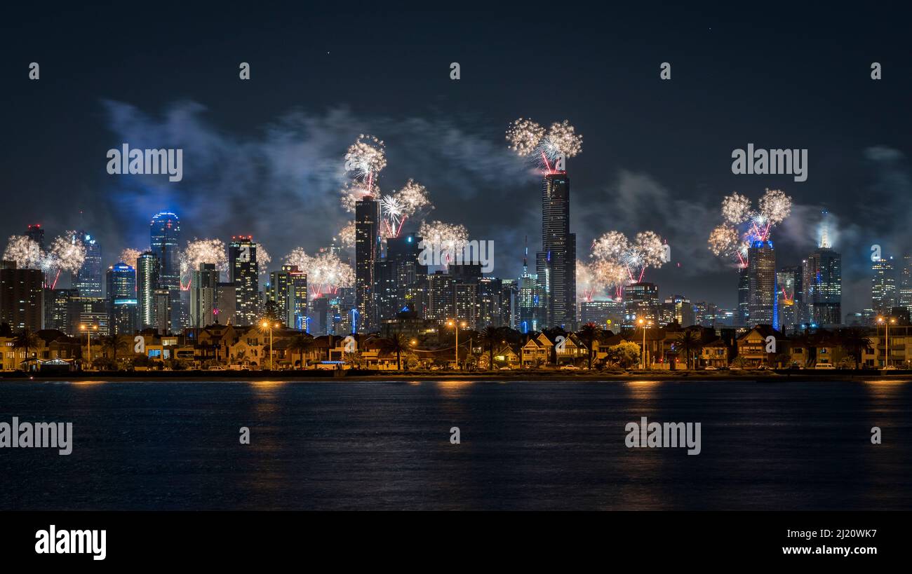 Fireworks over Melbourne city skyline for New Year celebrations. View from Port Philip Bay, St