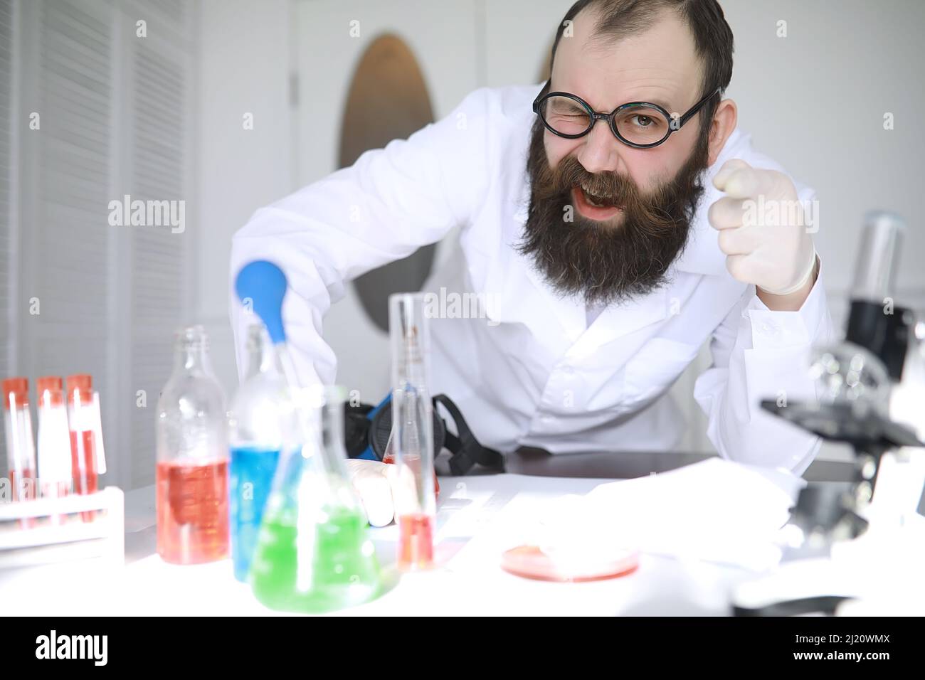 Chemist crazy. A mad scientist conducts experiments in scientific
