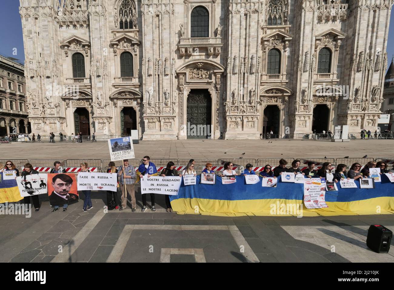 Protest of Ukrainian women in Piazza Duomo Milan against the war and  against the Russian leader Putin Stock Photo - Alamy
