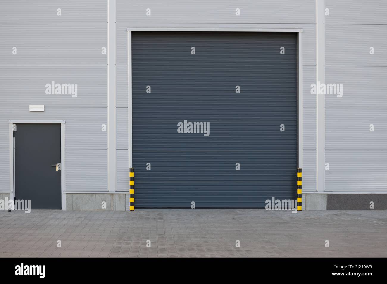 Roller door or roller shutter using for factory, warehouse or hangar. Outdoors Stock Photo