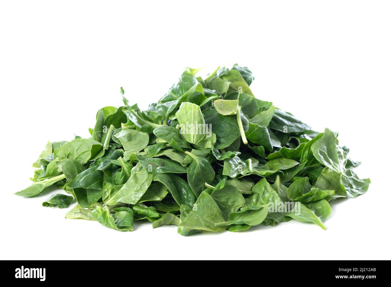 Pile of fresh green baby spinach leaves isolated on white background ...