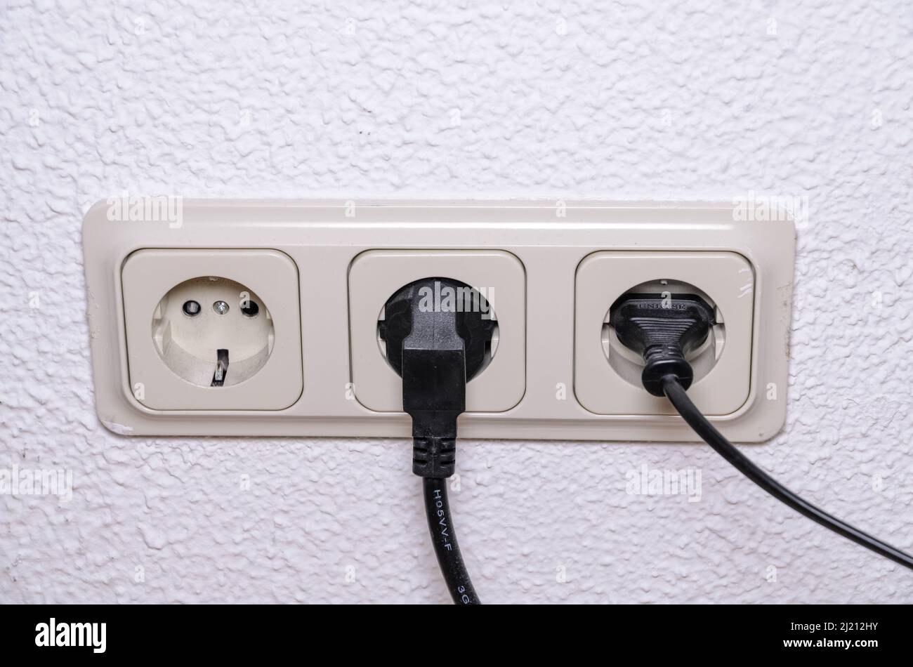 Power outlet or sockets on white wall indoors, Germany, Europe Stock Photo