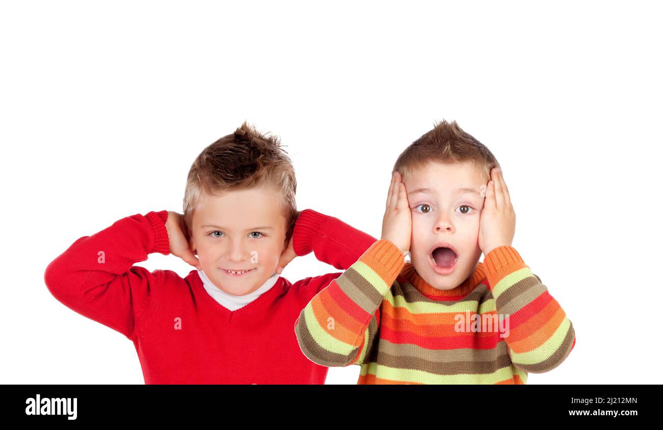 Children covering the ears and shocked by a loud sound isolated on a