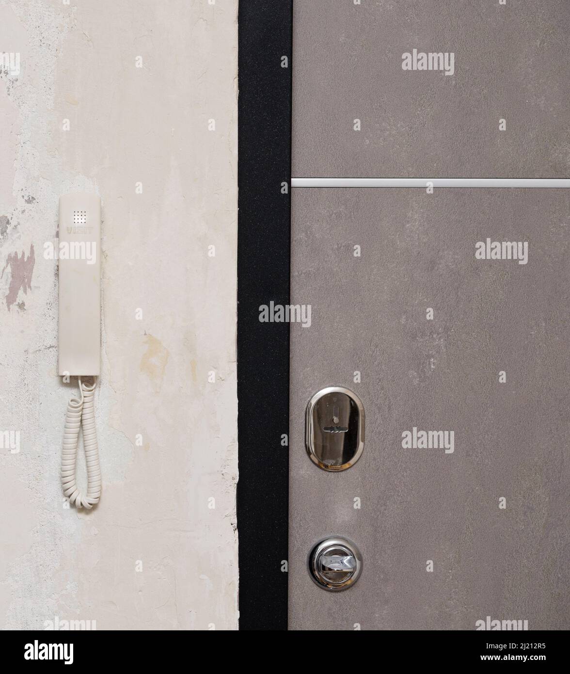 Intercom on a wall near door Stock Photo