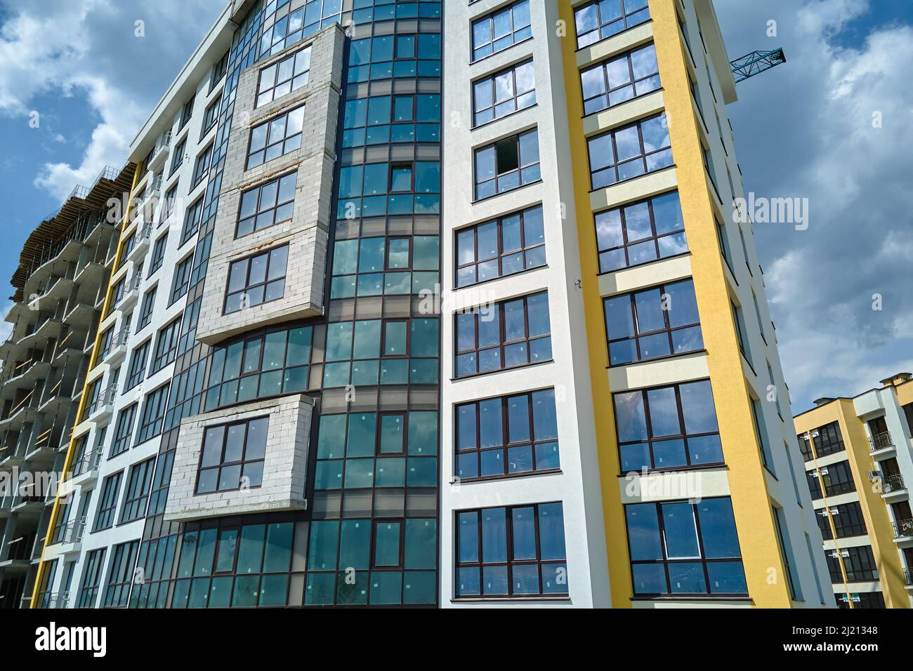 Architectural details of modern high apartment building facade with ...