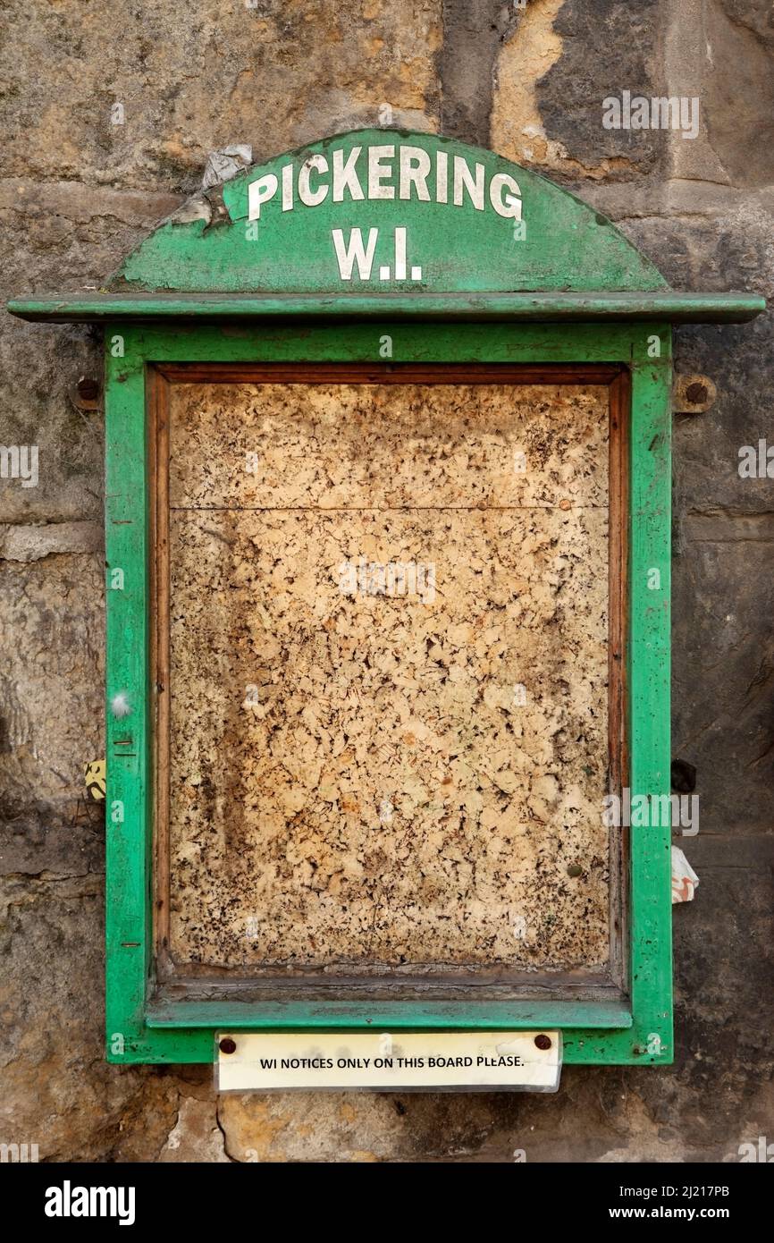 Empty noticeboard of the Pickering branch of the Women's Institute, North Yorkshire, UK. Stock Photo