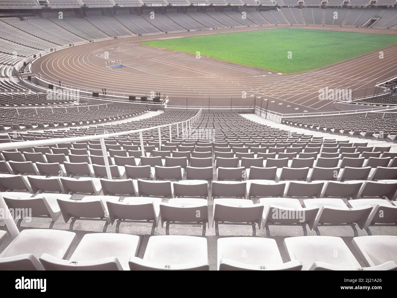 Stadium in Barcelona, Spain. Olympic landmark sports arena. Playing field outdoors. Rows of empty seats. Landmark tourist attraction in Montjuic park Stock Photo