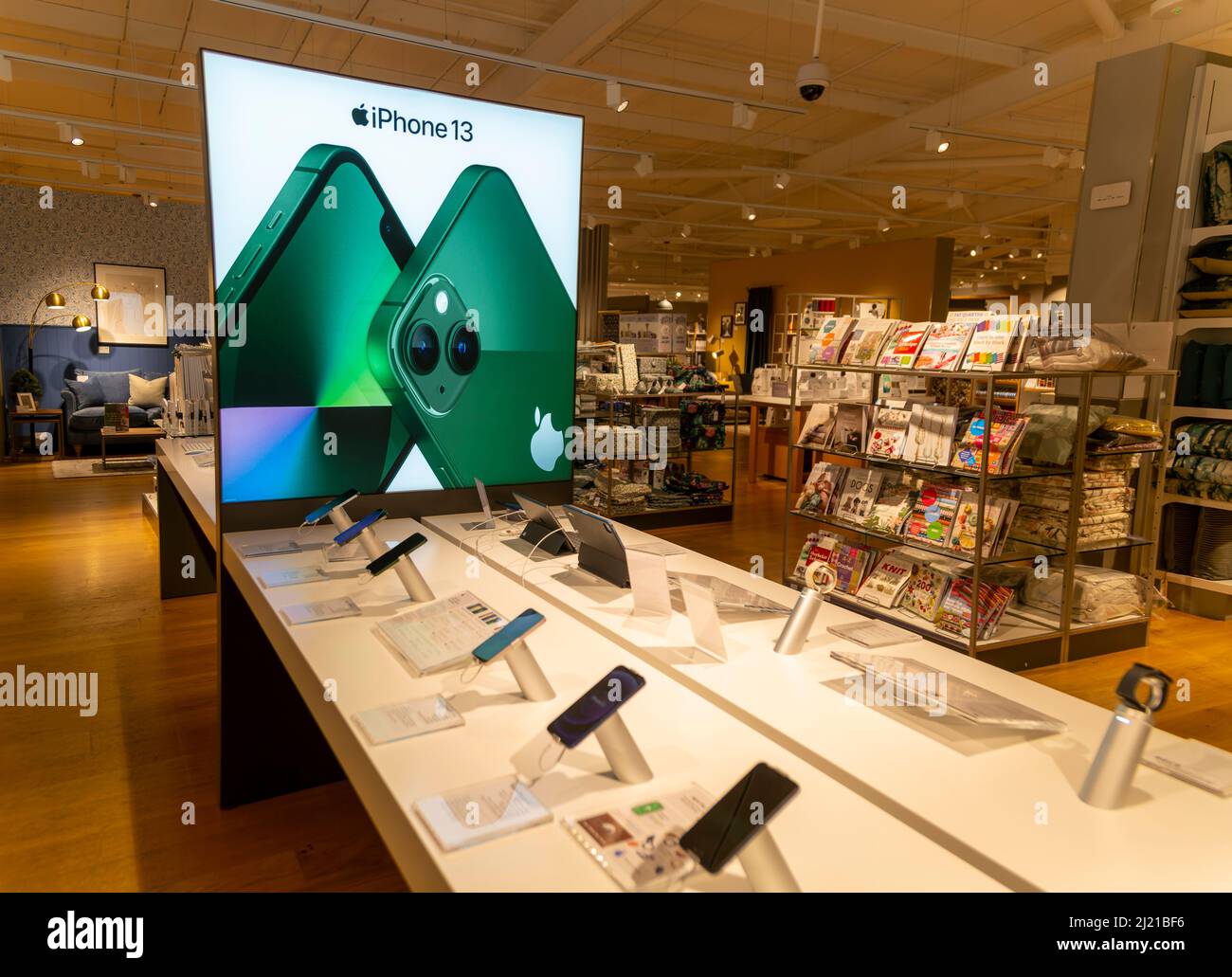 Apple iPhone 13 mobile phone display in John Lewis at Home shop