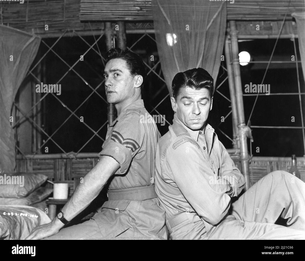 RICHARD TODD and RONALD REAGAN on set candid portrait at Elstree Studios during filming of THE HASTY HEART 1949 director VINCENT SHERMAN play John Patrick screenplay Ranald MacDougall Associated British Picture Corporation (BPC) / Warner Bros. Stock Photo