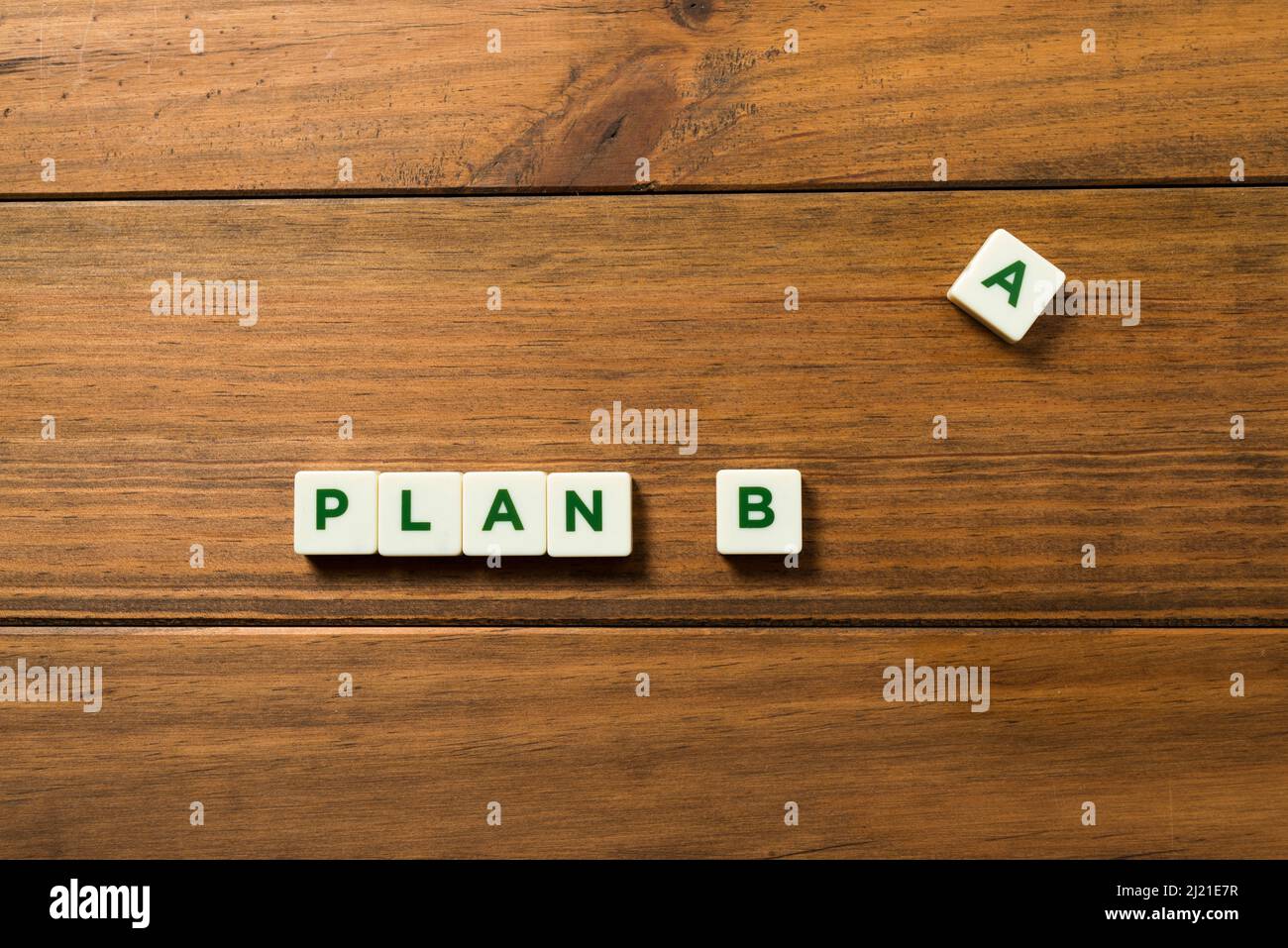 The phrase PLAN B is made up of lettered parts, the letter A is set aside. Concept of planning for the future, resilience and constancy. Background of Stock Photo