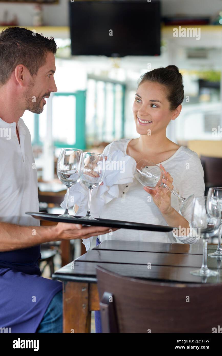 Waiter in restaurant cleaning wine hi res stock photography and images Waiter in restaurant cleaning wine hi res stock photography and images