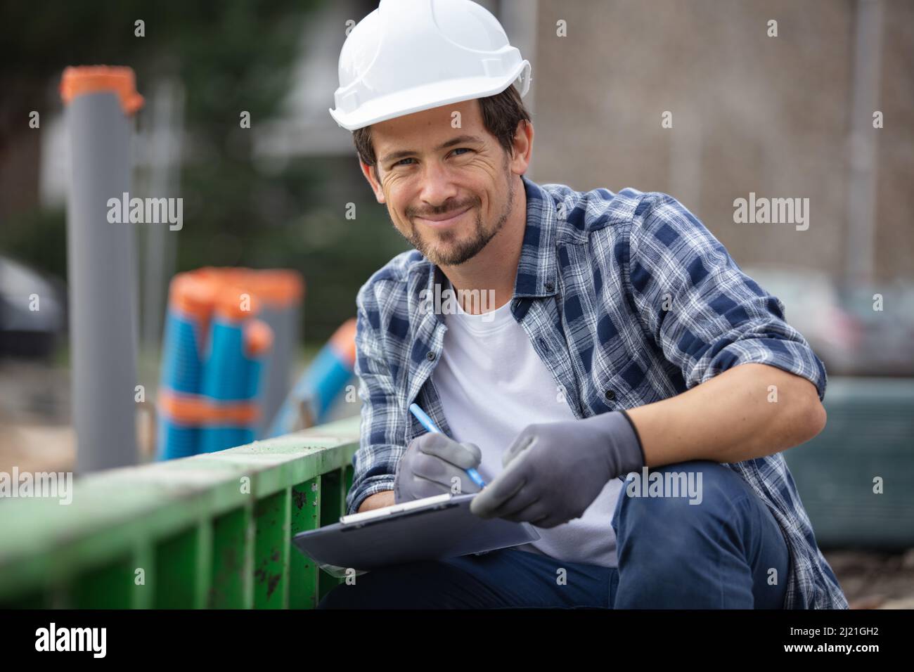 tired construction worker is thinking about perspectives Stock Photo
